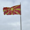 Flag of North Macedonia a stylised yellow sun on a bright red background