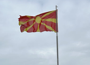 Flag of North Macedonia a stylised yellow sun on a bright red background