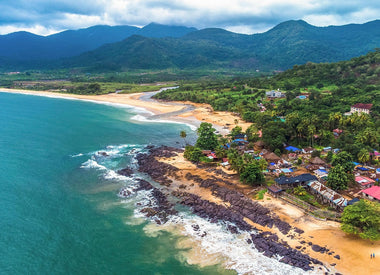 Sierra Leone coastline with verdant mountains in the distance