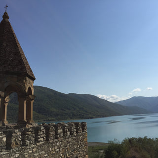 Ananuri Fortress overlooking Zhinvali reservoir on a bright cunny day