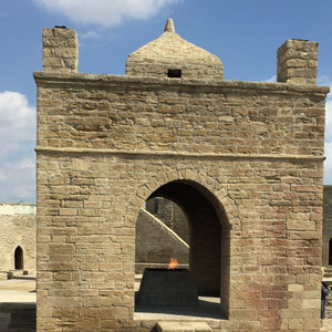 Atashgah Zoroastrian Fire Temple with lit flame. Located near Baku, Azerbaijan