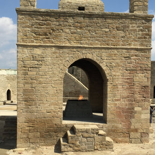 Atashgah Zoroastrian Fire Temple with lit flame. Located near Baku, Azerbaijan