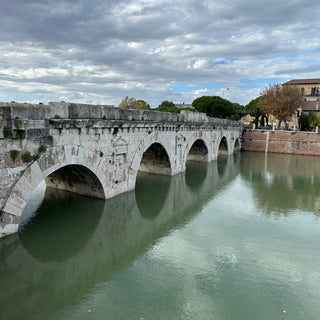 Roman bridge of Augustus in white stone with 5 arches in Rimini, Italy