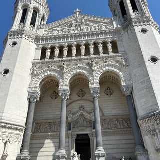 Basilica of Notre-Dame de Fourviere, Lyon, France with two towers against a clear blue sky