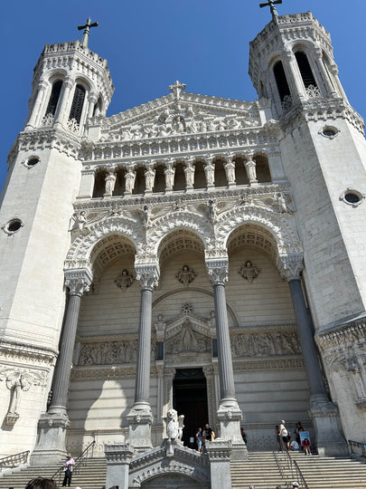 Basilica of Notre-Dame de Fourviere, Lyon, France with two towers against a clear blue sky