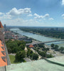 View of the red roof of Bratislava castle and the Danube with UFO bridge, Slovakia