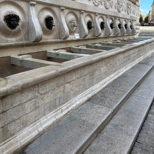 Calamo Fountain in Ancona, Italy. The Fountain features thirteen spouts, twelve covered by bronze masks, which represent satyrs and fauns.