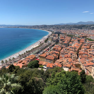 A view of the red rooftops of Nice, the beach and the Promenade des Anglais 