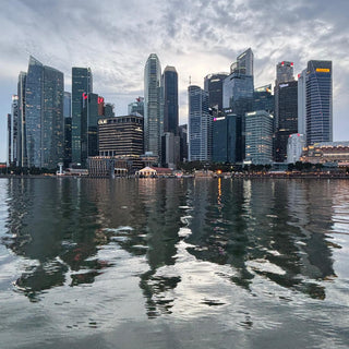 Cityscape Singapore with multiple skyscrapers reflected in the water