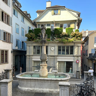 A marble statue and fountain in Zurich Switzerland