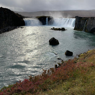 Godafoss waterfall in the shape of a horseshoe, creating a beautiful curtain of water. Iceland