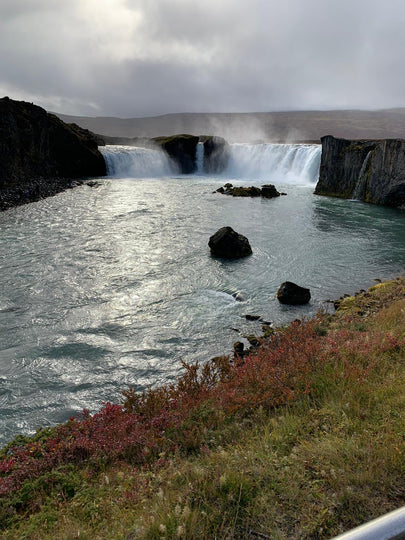 Godafoss waterfall in the shape of a horseshoe, creating a beautiful curtain of water. Iceland