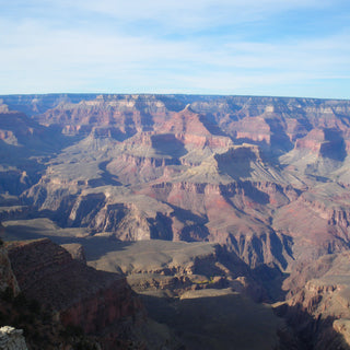 The Grand Canyon, a vast and iconic canyon in Arizona, carved by the Colorado River over millions of years, reaching depths of over a mile and stretching 277 miles long