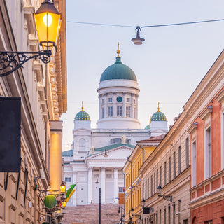 A distinctive landmark in the Helsinki cityscape, with its tall, green dome surrounded by four smaller domes, the building is in the neoclassical style