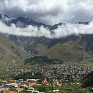 Stepantsminda in Kazbegi, Georgia. A view of the town and surrounding mountains