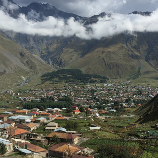 Stepantsminda in Kazbegi, Georgia. A view of the town and surrounding mountains