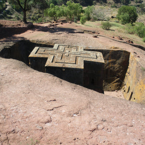 Cross shaped church carved down into solid rock in Lalibela, Ethiopia