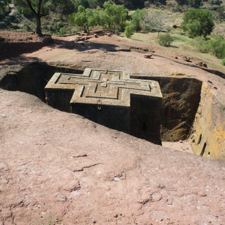 Cross shaped church carved down into solid rock in Lalibela, Ethiopia