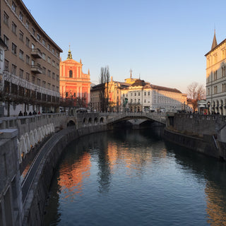 Single span stone bridge crossing the Ljubljanica river running through the centre of Ljubljana Slovenia