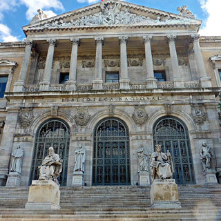 National Library of Spain in Madrid. A grand, neoclassical building featuring a prominent exterior staircase and a Corinthian portico