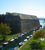 Naval defence wall and canal with small boats, Corfu, Greece 