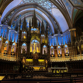 Notre-Dame Basilica of Montreal interior with ornate decor featuring blues, azures, reds, purples, silver and gold, with intricate wooden carvings