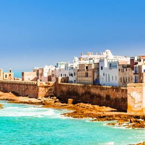 View of the old city of Essaouira in Morocco with red coastal wall and ramparts