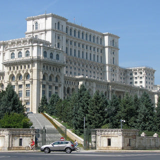 The massive white facade of the People's Palace Bucharest, Romania