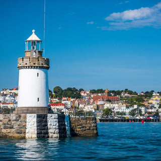 White lighthouse in St. Peter Port Harbour, Guernsey, Channel Islands