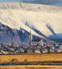 View of Reykjavik and Church of Hallgrímur with snowy mountain background