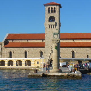 Harbour entrance in Rhodes with statue of stag on a column