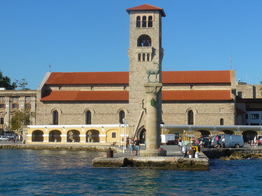 Harbour entrance in Rhodes with statue of stag on a column