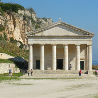Facade of St George Church in white stone with 6 columns, Corfu, Greece