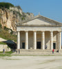 Facade of St George Church in white stone with 6 columns, Corfu, Greece