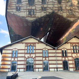 Art Museum with original building reflected in the modern glass extension, Krakow, Poland