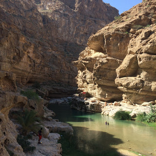 Wadi Shab in Oman, a river flowing through a deep gorge